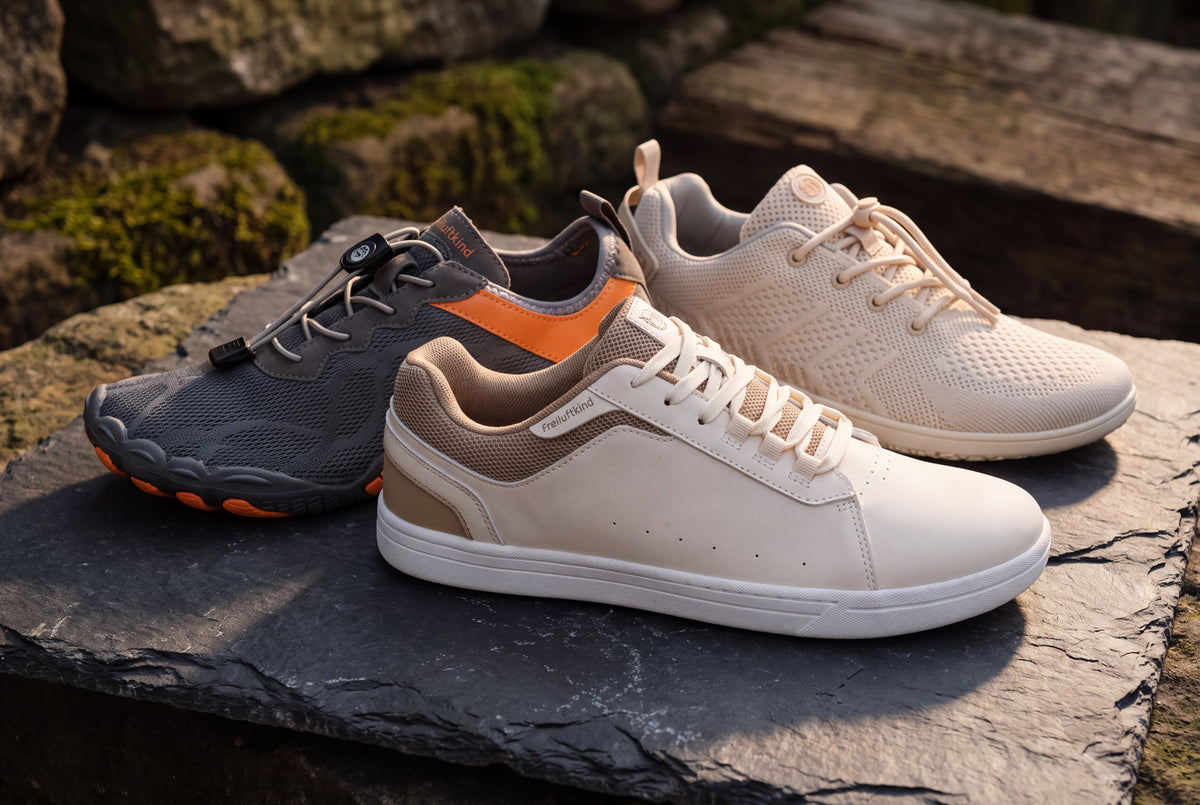 Barfußschuhe für Herren: Kokoda, Canyon und Camino nebeneinander auf dunklem Stein in Nahaufnahme